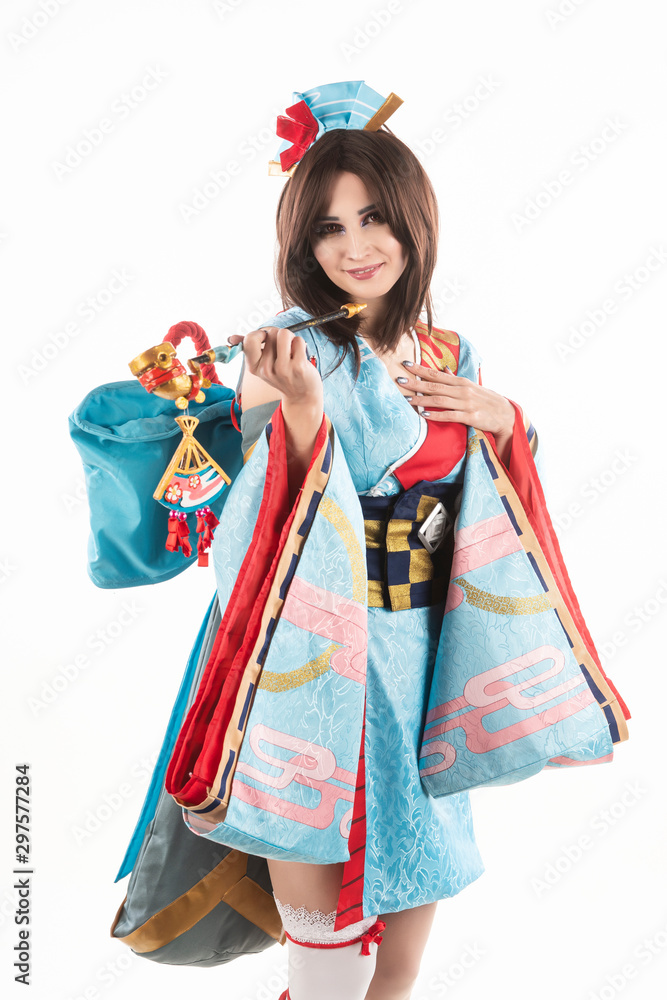 Beautiful leggy busty cosplayer girl wearing a stylized Japanese kimono  costume cheerfully posing holding a fake pipe in the wind. Isolated on a  white background. Stock-Foto | Adobe Stock