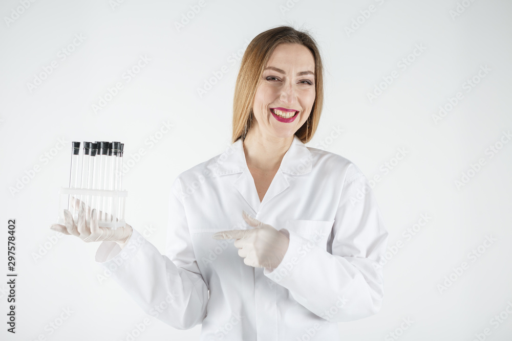 Young scientist holding a test tubes in laboratory. Young scientist holding a test tubes in laboratory.