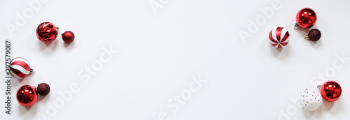 Christmas banner - red decorations on white background. Christmas, new year concept. Flat lay, top view