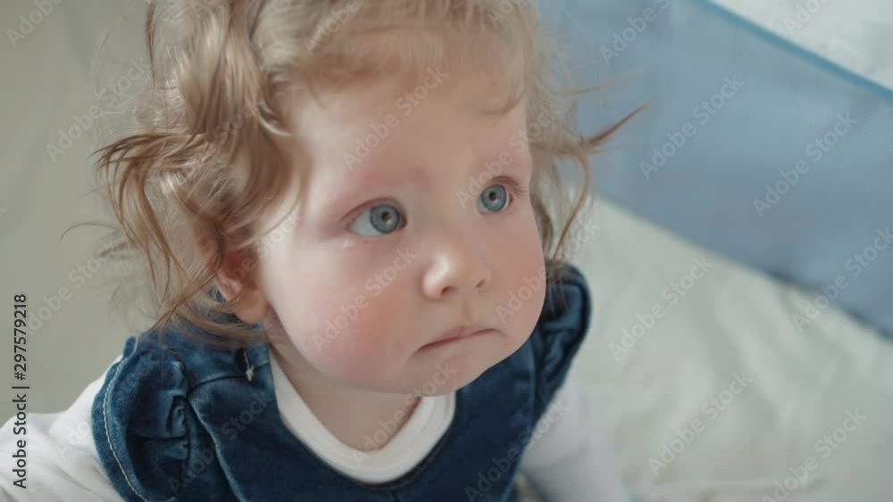 Portrait of cute year old baby girl standing and looking at camera Portrait of cute year old baby girl standing and looking at camera