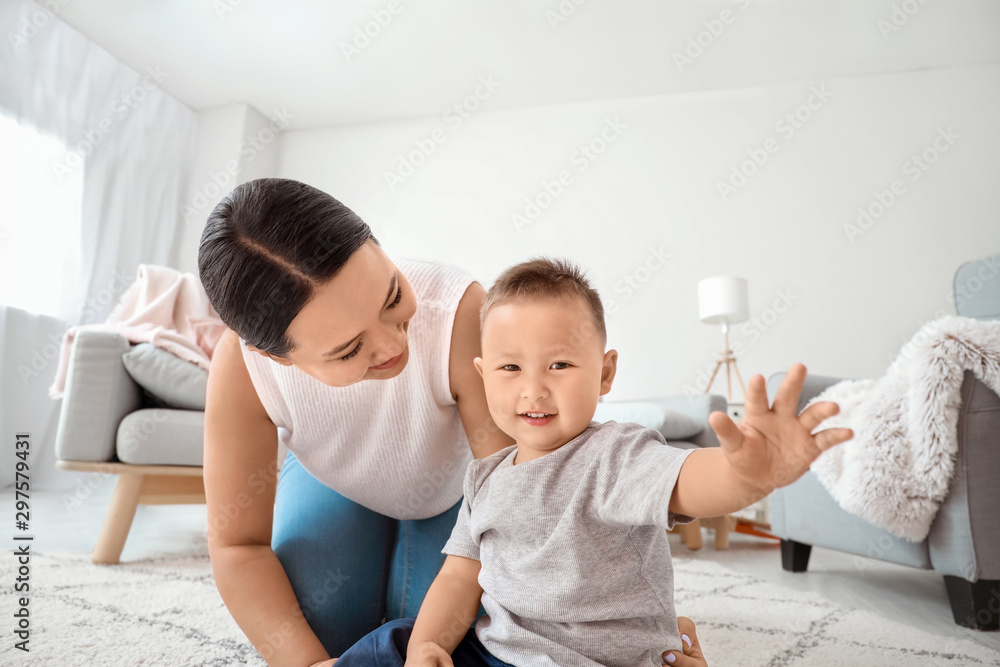 Happy Asian mother and cute little baby at home Happy Asian mother and cute little baby at home