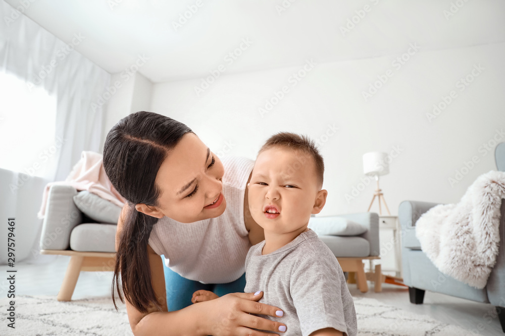 Happy Asian mother and cute little baby at home Happy Asian mother and cute little baby at home