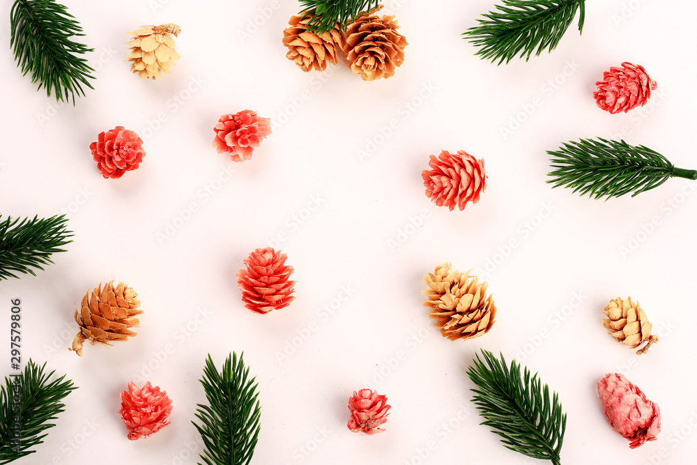New Year's layout. Fir branches. Multi-colored cones. Top view. White background. New Year's layout. Fir branches. Multi-colored cones. Top view. White background.