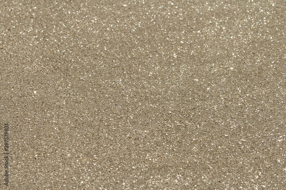 Fototapeta premium Background of natural brillant golden sand with paettes