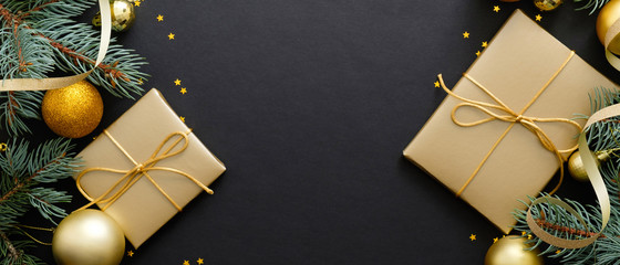 christmas decorations and holiday gift boxes on black background