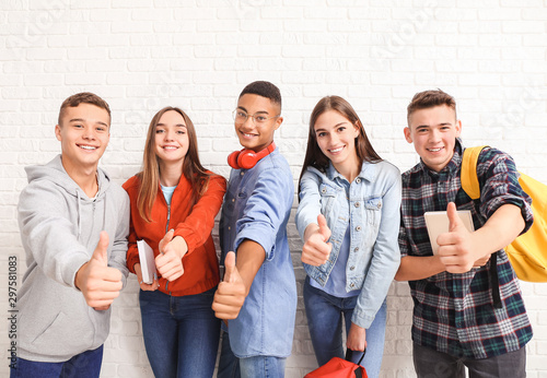 Portrait of teenagers showi...