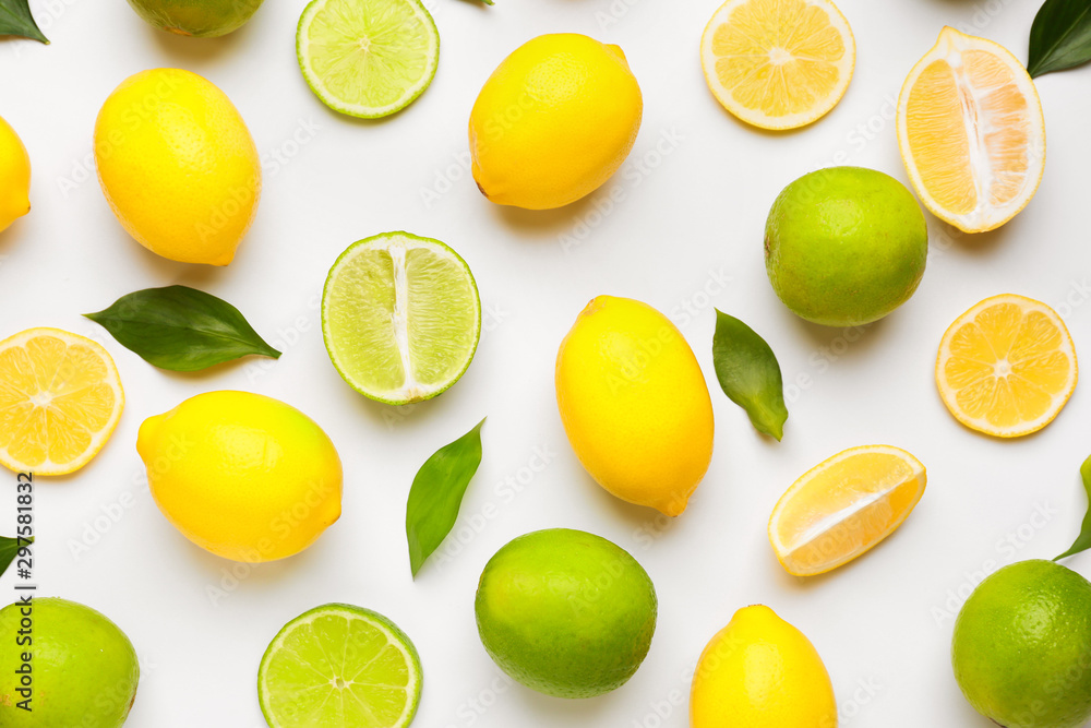 Ripe lemons and limes on white background
