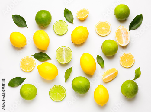 Wallpaper Mural Ripe lemons and limes on white background