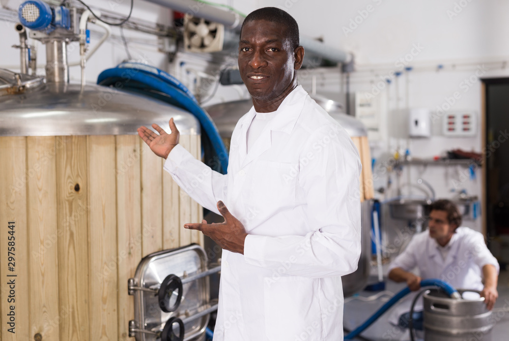 African american man brewer is inviting to brew-house