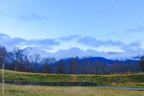 Beautiful landscape view of Hakuba in the winter with snow on the mountain and blue sky background in Nagano Prefecture Japan.