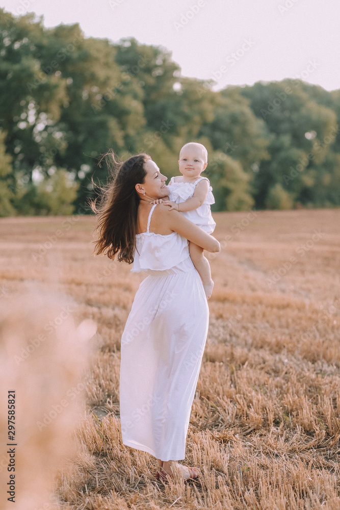 mother small daughter white dresses field straw