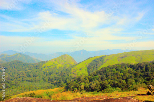 Blue sky and green valley view from rosemala, aryankavu, kerala