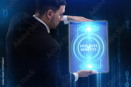 The concept of business, technology, the Internet and the network. A young entrepreneur working on a virtual screen of the future and sees the inscription: Employee benefits