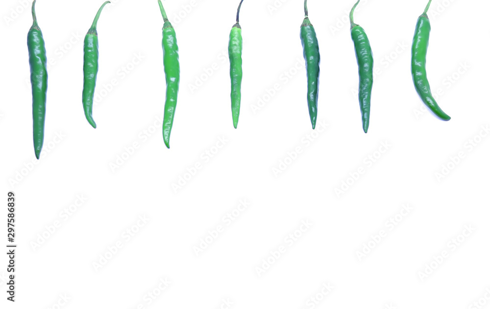 Fototapeta premium Green chilies border isolated on white background.
