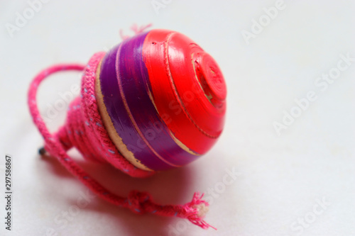 Pambaram or Bambaram wooden toy is a traditional throwing top used mainly in India. photo