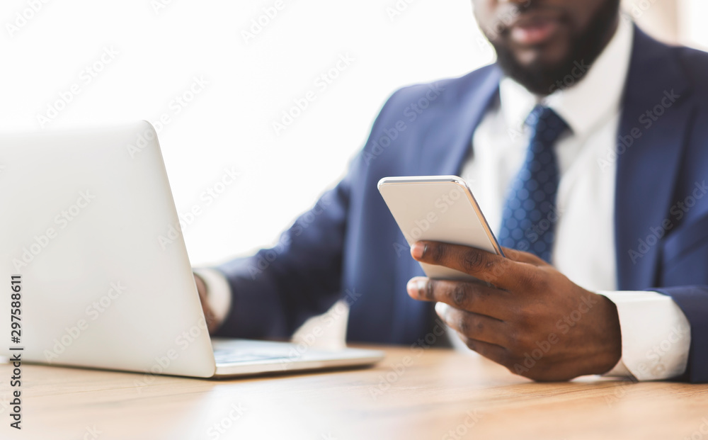 Close up of businessman using cellphone at workplace Close up of businessman using cellphone at workplace