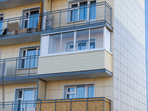 Fotografia, Obraz New glazed balcony among simple open balconies