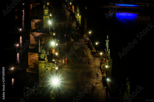 Low angle view of Charles Bridge from Old Town Bridge Tower at night. Long exposure. Holidays in Prague