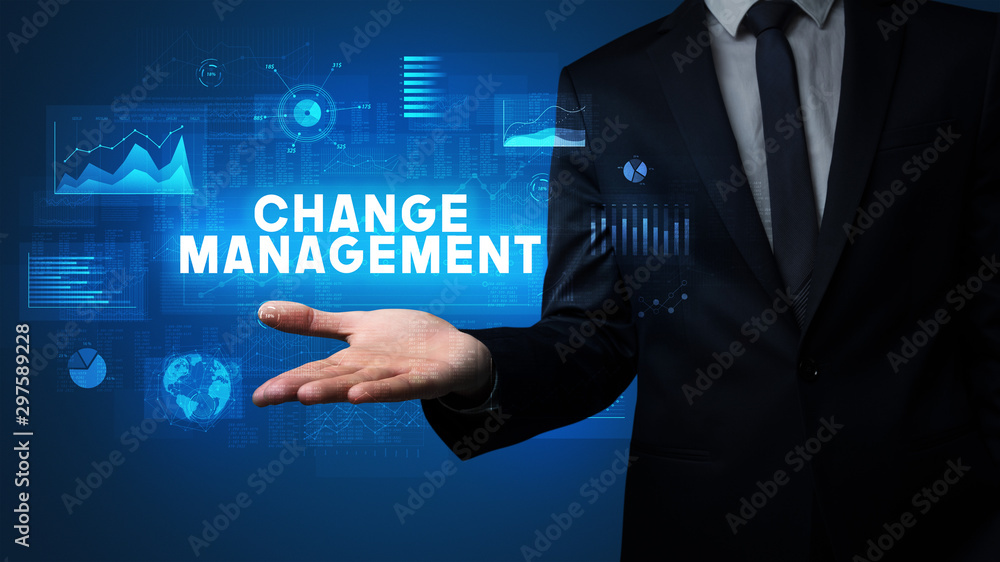 Obraz premium Hand of Businessman holding CHANGE MANAGEMENT inscription, business success concept