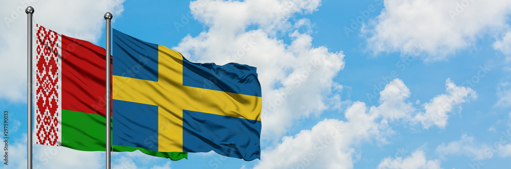 Belarus and Sweden flag waving in the wind against white cloudy blue sky together. Diplomacy concept, international relations. Belarus and Sweden flag waving in the wind against white cloudy blue sky together. Diplomacy concept, international relations.