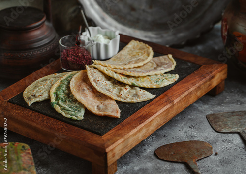 gutab stuffed flatbreads board served with sumac and yoghurt photo