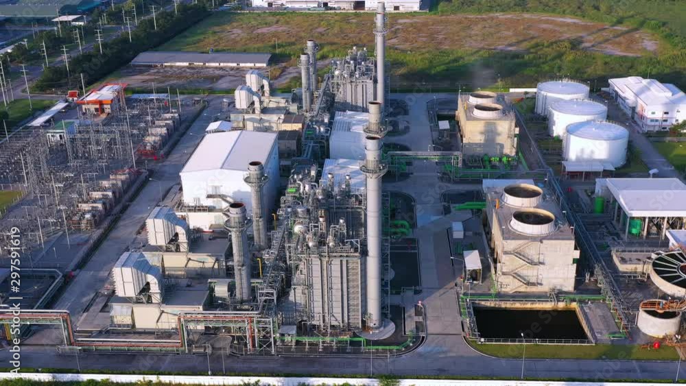Aerial view Industrial power plant The oil refinery and oil industry during the day time in the sunshine. Dolly shot 