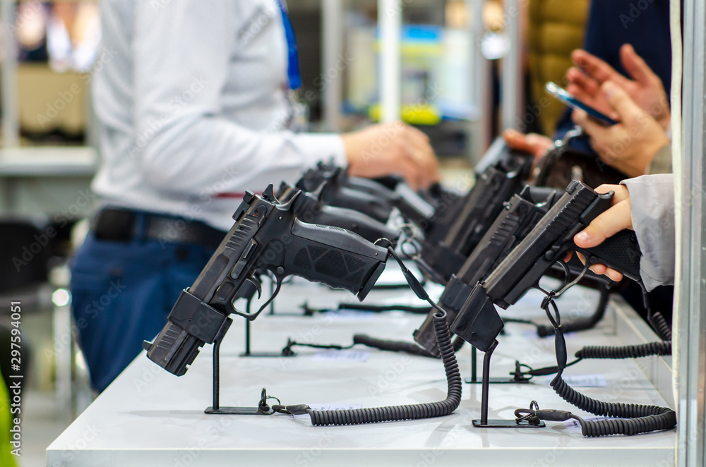 Gun Display Stands. Pistols for sale in the store. Gun Display Stands. Pistols for sale in the store.