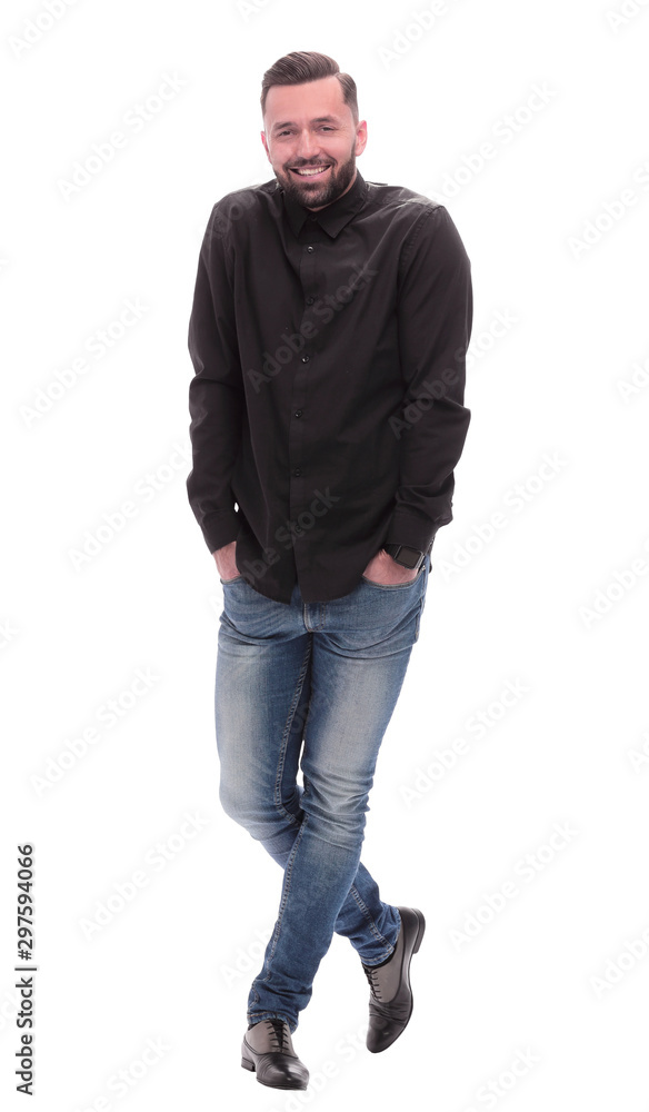 in full growth. successful young man in jeans in full growth. successful young man in jeans
