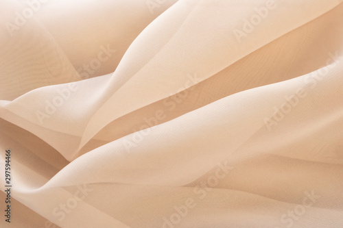 Light abstract beige textile background photo
