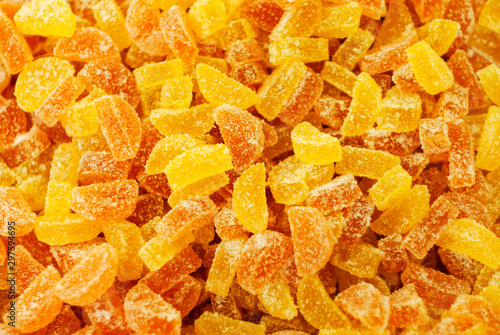 background - golden yellow translucent gumdrops in sugar