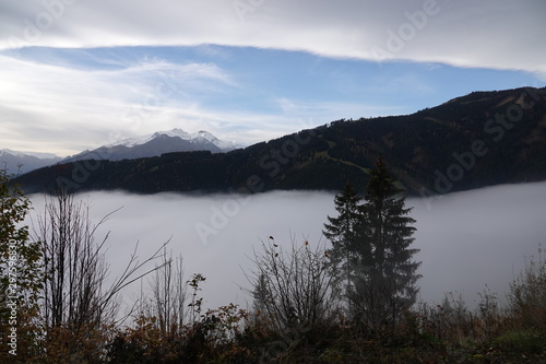 autumn in the mountain with fog in the valley