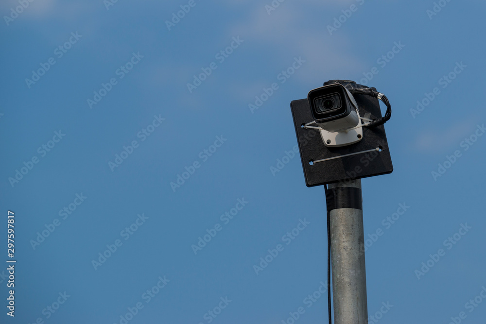 CCTV Outdoor address security cameras against blue sky background. CCTV Outdoor address security cameras against blue sky background.