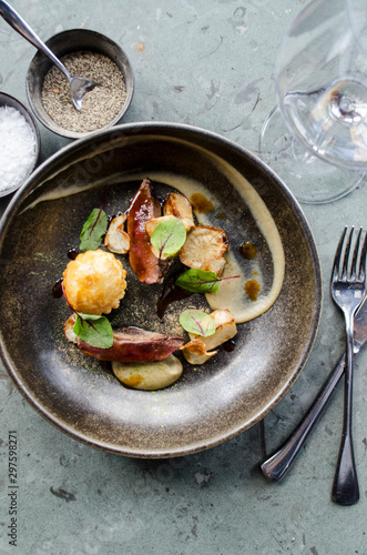 Restaurant Place Setting with Pigeon Dish