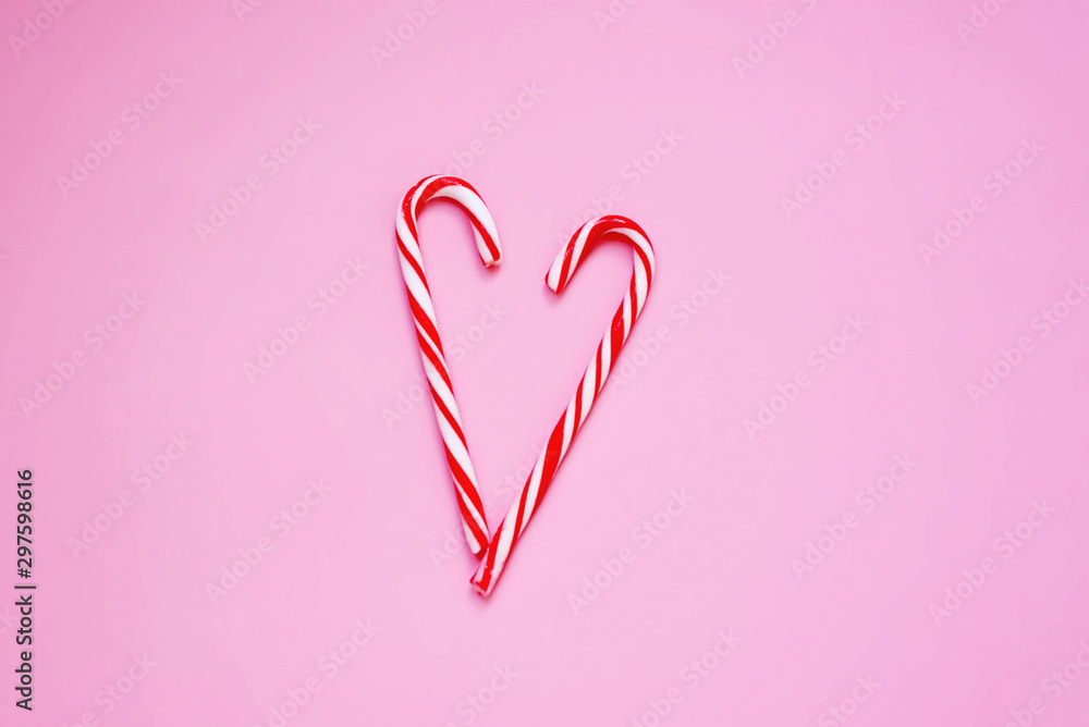 Heart on pink background. Candies. Gifts for the New year and Christmas. Traditions and holidays concept. Top of view. 
