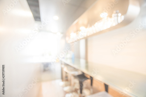 Abstract blurred bar counter interior. illuminated blurry pub and restaurant with defocused effect. Blur background or backdrop for food and drink business concept