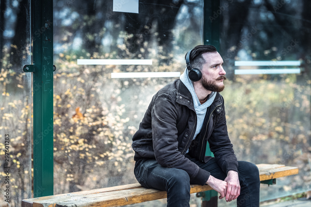 Fototapeta premium Hipster man waiting for the bus