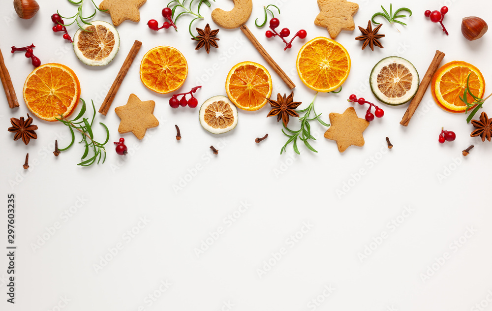  Christmas composition with cookies, dried oranges, cinnamon sticks and herbs on white background. Natural food ingredient for cooking or Christmas decor for home. Flat lay. - obrazy, fototapety, plakaty 