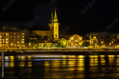 View of the evening Budapest from a pleasure boat. Pest in the evening light. Night city. Danube river at night. Walk and tour the Danube.