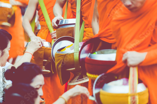 Slika na platnu Buddhist monks on everyday morning traditional alms giving in Luang Prabang, Laos