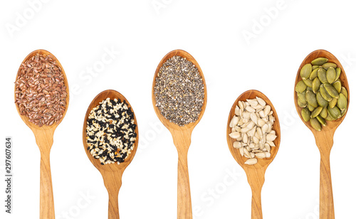organic grains seeds in wooden spoon,.Chia seed, Sesame,Flax isolated on white background
