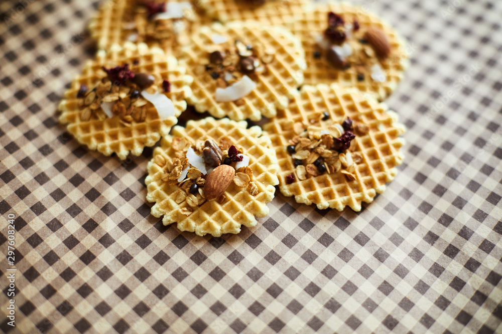 Traditional belgian waffles with nuts mix, oatmeal and almonds. Haealthy food. Flat lay, top view, copy space Traditional belgian waffles with nuts mix, oatmeal and almonds. Haealthy food. Flat lay, top view, copy space