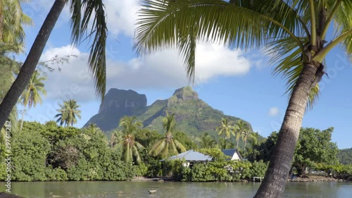 SEAMLESS LOOP VIDEO: French Polynesia paradise. Bora Bora and Mount Otemanu in Tahiti, French Polynesia, palm trees coral lagoon sea and Mt Pahia, Mt Otemanu, Tahiti, south Pacific Ocean. photo