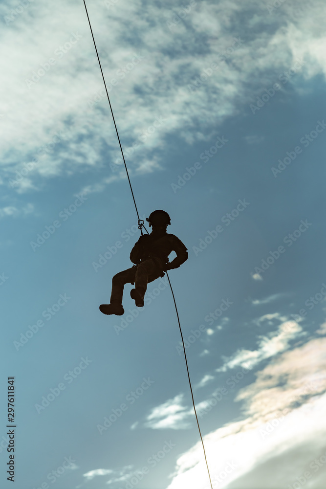 Landing of special forces on a rope from a helicopter Landing of special forces on a rope from a helicopter