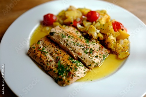 healthy and fresh cooking at home - salmon fillet with potatoes in olive oil