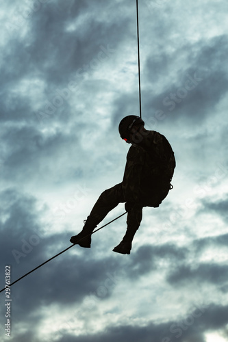 Landing of special forces on a rope from a helicopter 