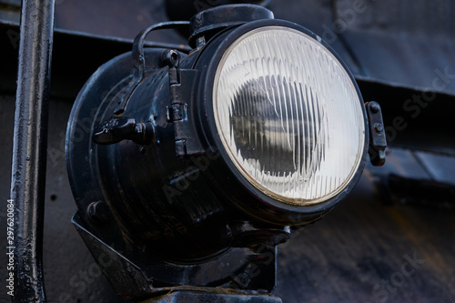 Lamp of a black historic locomotive, detail view