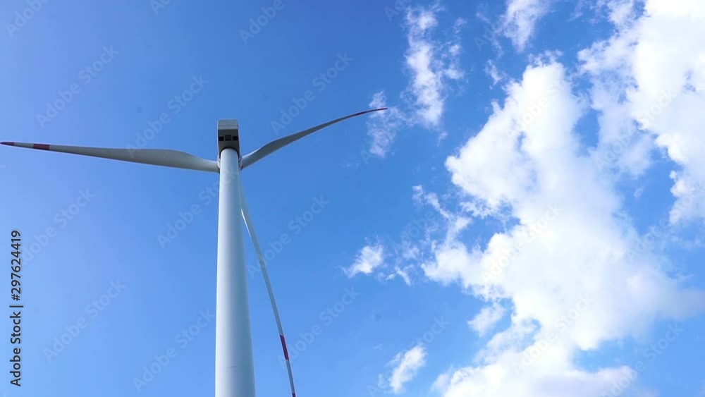 The technology of renewable energy from wind turbines and bright skies footage timelapse The technology of renewable energy from wind turbines and bright skies footage timelapse