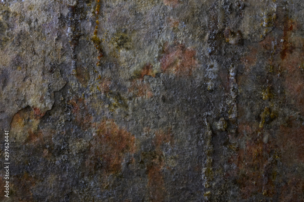Texture. Fragment of the wall of an old wet basement covered with spots of rust and drops of tar. Close-up. Texture. Fragment of the wall of an old wet basement covered with spots of rust and drops of tar. Close-up.