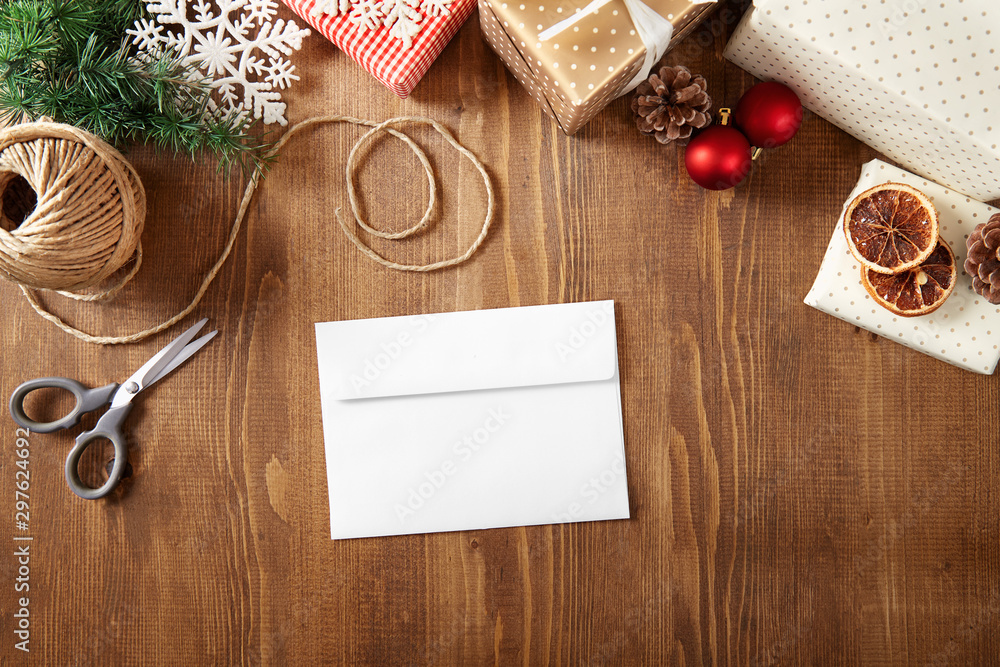 Christmas letter with copy space on a wooden background viewed from above. Top view. Christmas greeting card Christmas letter with copy space on a wooden background viewed from above. Top view. Christmas greeting card