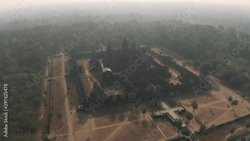 Angkor Wat Temple in Cambodia sunrise fog drone flight